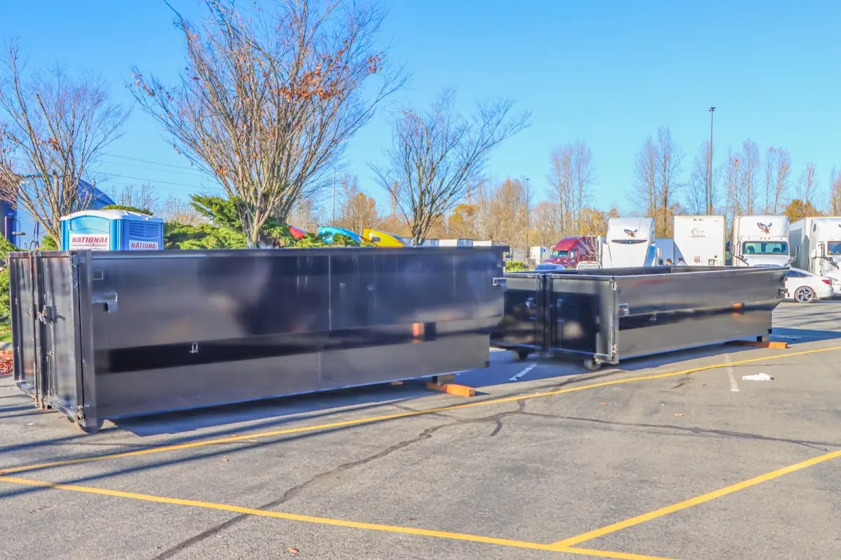 Professional dumpster rental service with roll-off container on residential driveway in Hornsby Bend